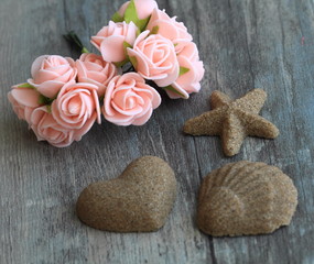 pink flowers juxtaposed against wooden background