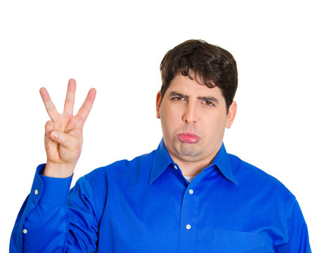 Third place loser. Man shows three fingers, white background 
