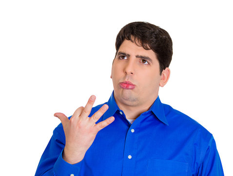 Confused young man trying to remember important information