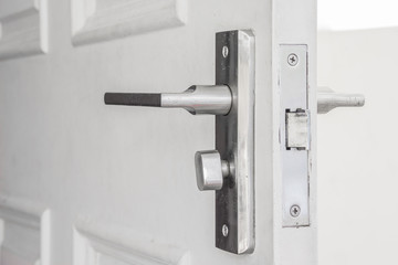steel door knob on the white door