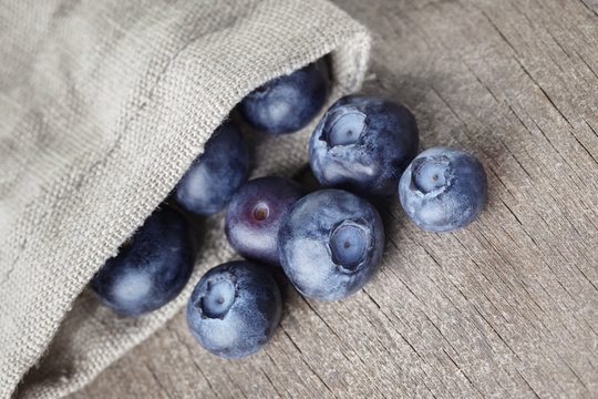 ripe blueberries falls of sack bag