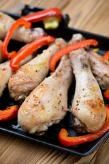 Close-up of grilled chicken legs and bell pepper slices