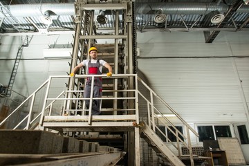 Man in a safety hat on a factory