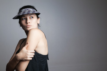Beautiful brunette woman in stylish hat