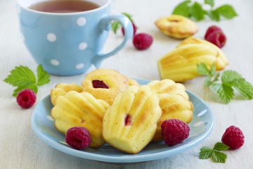 French pastries madeleines with raspberries.