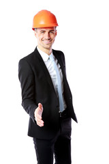 businessman in helmet offering handshake over white background