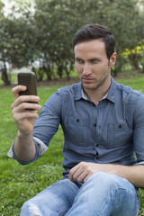 Man Using Phone and Tablet