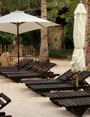 sunbeds under a white umbrella
