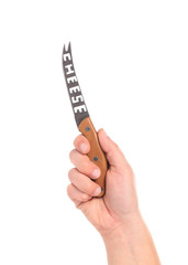 Hand holding cheese knife.
