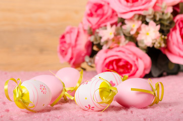 Easter eggs and bouquet of roses