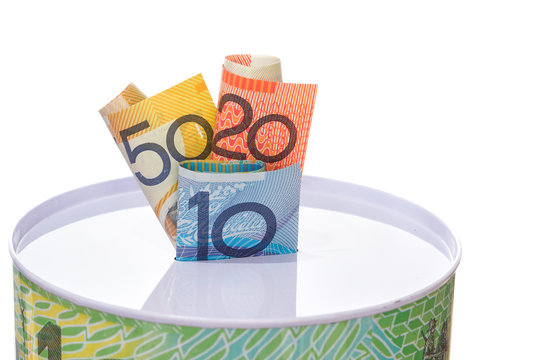 Australian Notes Stuffed In To A Money Tin