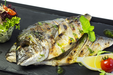 Baked fillet of bream fish cooked on the grill in the restaurant