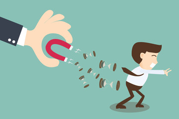 Boss hand holding magnet attracting time businessman