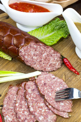 sausage on a wooden plate in a restaurant