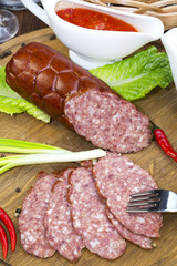 sausage on a wooden plate in a restaurant