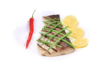 Grilled fish with vegetables.