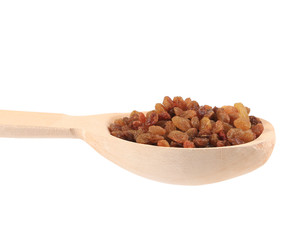 Wooden spoon with raisins.