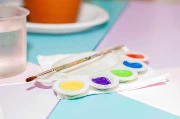 Acrylic colors on colorful table