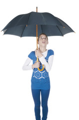 Young woman with umbrella looking up