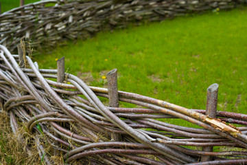 Wooden fence braided into a beautiful garden