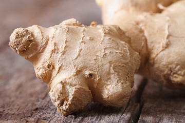 fresh ginger root macro on an old wooden table. horizontal