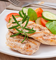 Grilled chicken breasts and vegetables