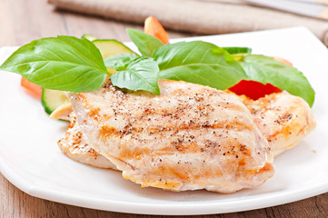 Grilled chicken breasts and vegetables