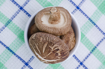 Fototapeta na wymiar Organic Brown Baby Bella Mushrooms against a background