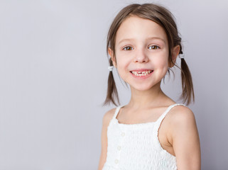 Young preschooler girl with wide smile