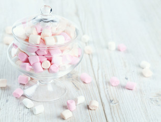 marshmallows in beautiful glass dish on a wooden table