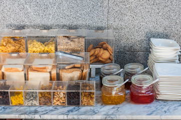 grain, cereal, bread & jam on table