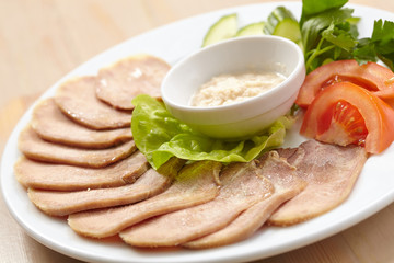 Slices of boiled beef tongue