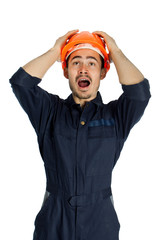 Funny worker in helmet with emotion on her face