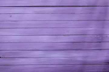 Wooden background texture in a pretty purple