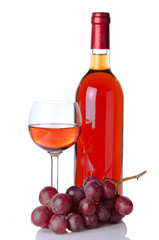 Fototapeta premium Bottle and glass of wine with red grapes