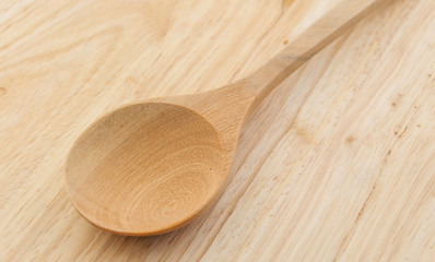 wood spoon on wood background