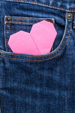 origami heart in blue jean pocket