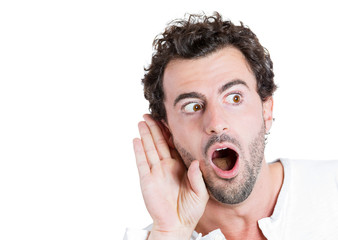 Portrait Curious man, hand to ear, listening to latest rumors