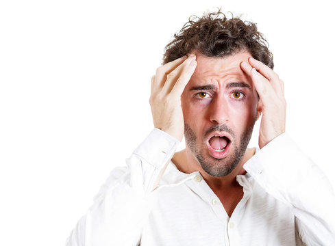 Headache. Young stressed man, student having bad migraine
