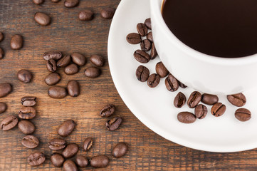 coffee cup with coffee bean on wooden background