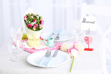 Beautiful spring table setting on light background