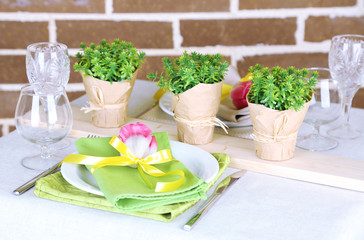 Beautiful spring table setting on bright background