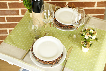 Beautiful holiday Easter table setting in green tones,