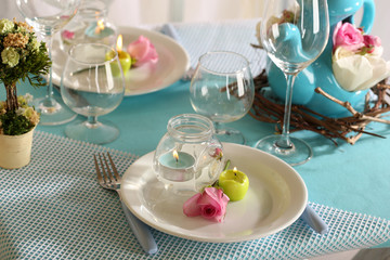 Beautiful holiday Easter table setting in blue tones,