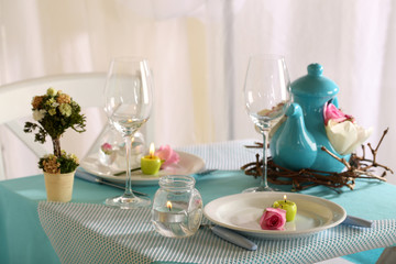 Beautiful holiday Easter table setting in blue tones,