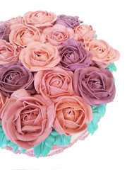 colorful roses decorate on cake isolated on white background