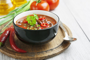 Chili soup with red beans and greens