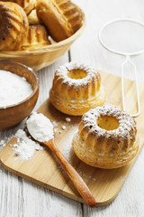 Obraz na płótnie Canvas Homemade muffins powdered sugar