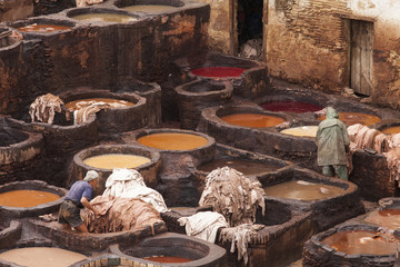 FES, MOROCCO - NOVEMBER 23: Workers at leather factory perform t
