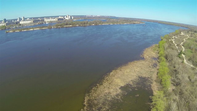 Flight over  big river  and city. Aerial panorama view